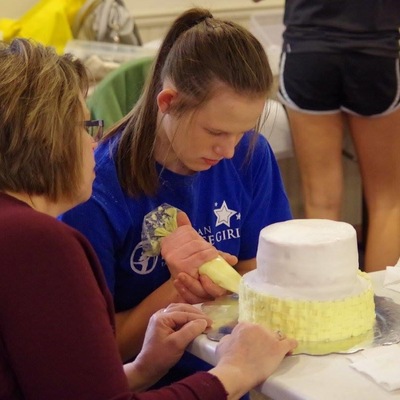 Learning to decorate a tiered cake